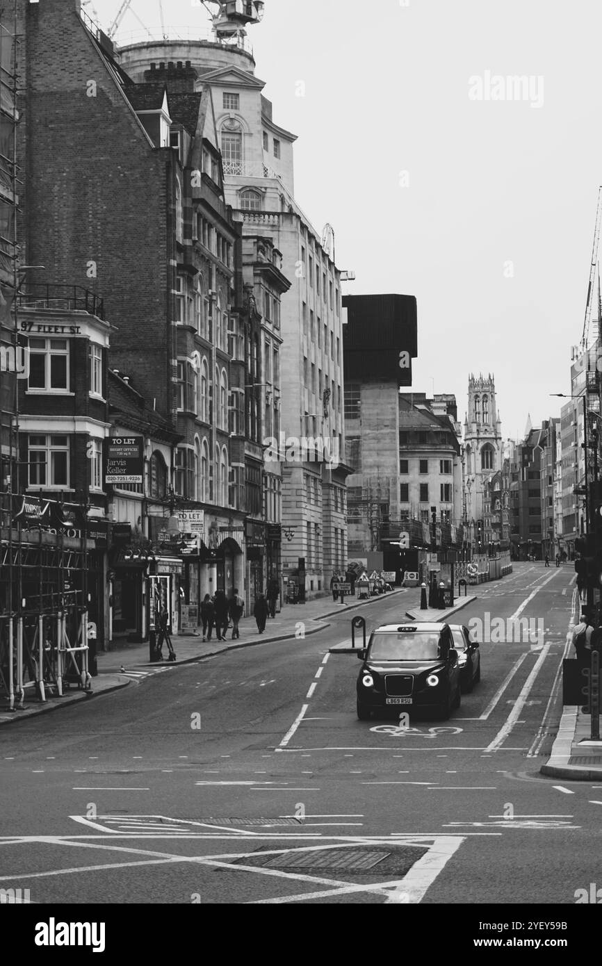 Black and White Photo of Black cab on London Street Stock Photo