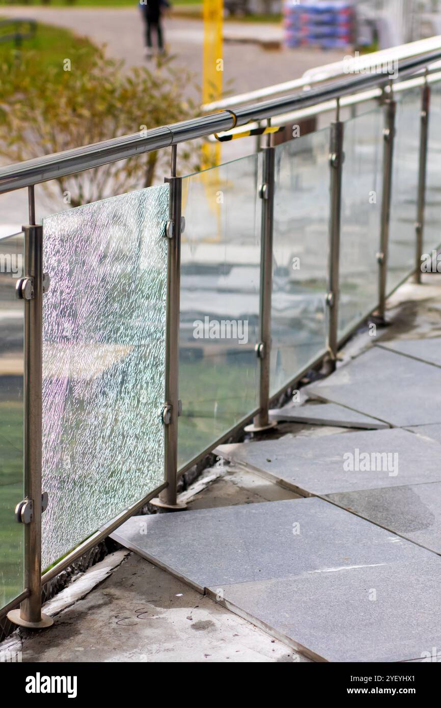 A durable stainless steel railing featuring a glass panel integrated ...