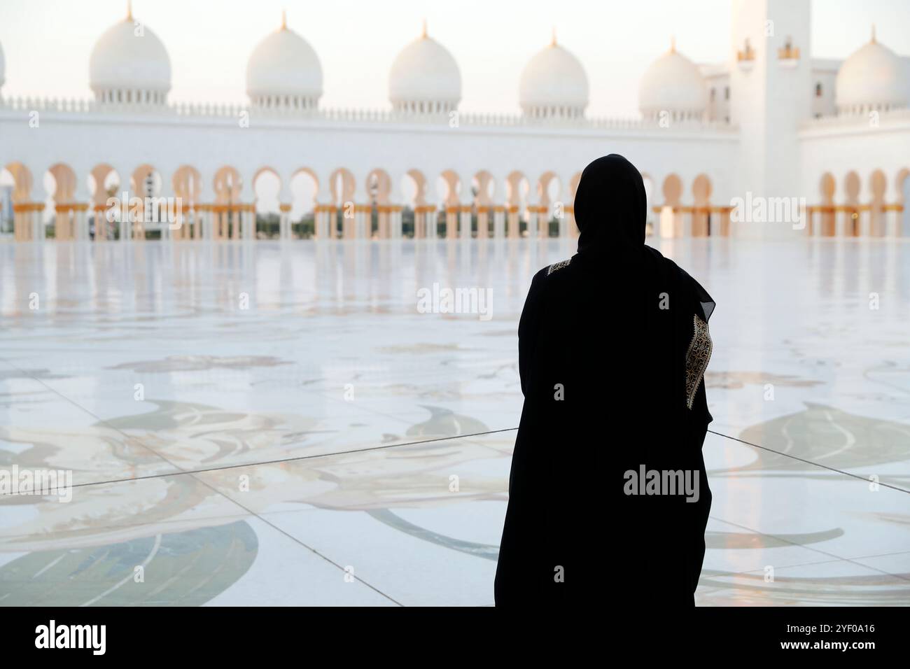 Sheikh Zayed Grand Mosque. Muslim woman wearing black abaya. Abu Dhabi ...