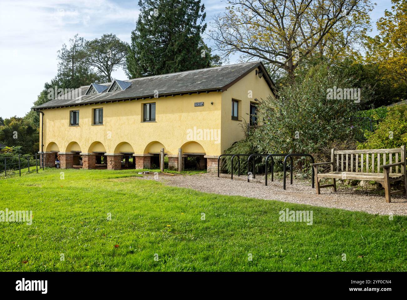 Killerton House public toilets in old raised yellow building near Exeter, Devon, UK on 20 October 2024 Stock Photo
