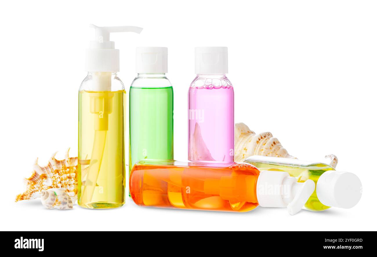 Assorted skincare products displayed on a white surface with a seashell Stock Photo