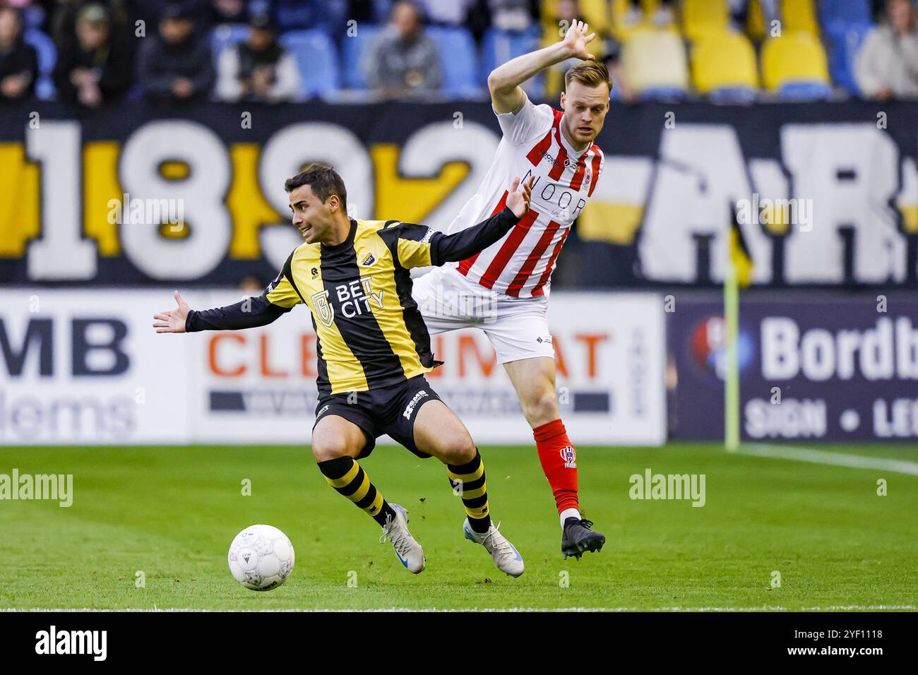 ARNHEM, 02-11-2024, Stadium GelreDome, football, Keukenkampioen divisie, season 2023/2024, Vitesse player Theodosis Macheras and TOP Oss player Xander Lambrix during the match Vitesse - TOP Oss Credit: Pro Shots/Alamy Live News Stock Photo