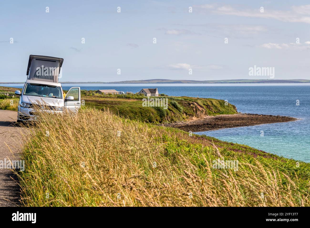 Camper van parked at Waulkmill Bay, Orkney Mainland. Stock Photo