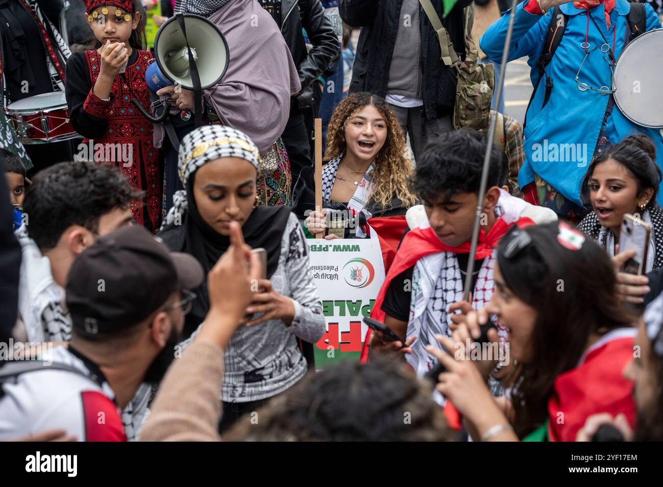 People take part in a Palestine Solidarity Campaign rally in central ...