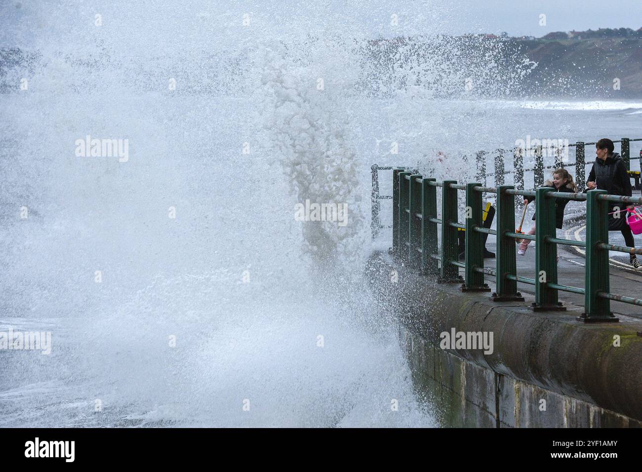 Sandsend, North Yorkshire, UK. 2nd November, 2024.  Waves from the high tide crash against the harbour wall at Sandsend, North Yorkshire Neil Squires/Alamy Live News Stock Photo