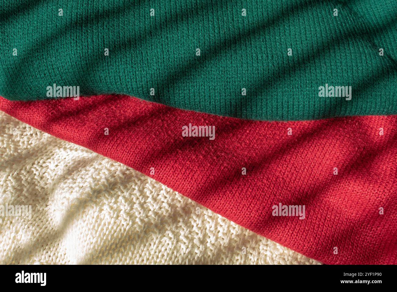 Wool knitted sweaters texture clothing background Stock Photo