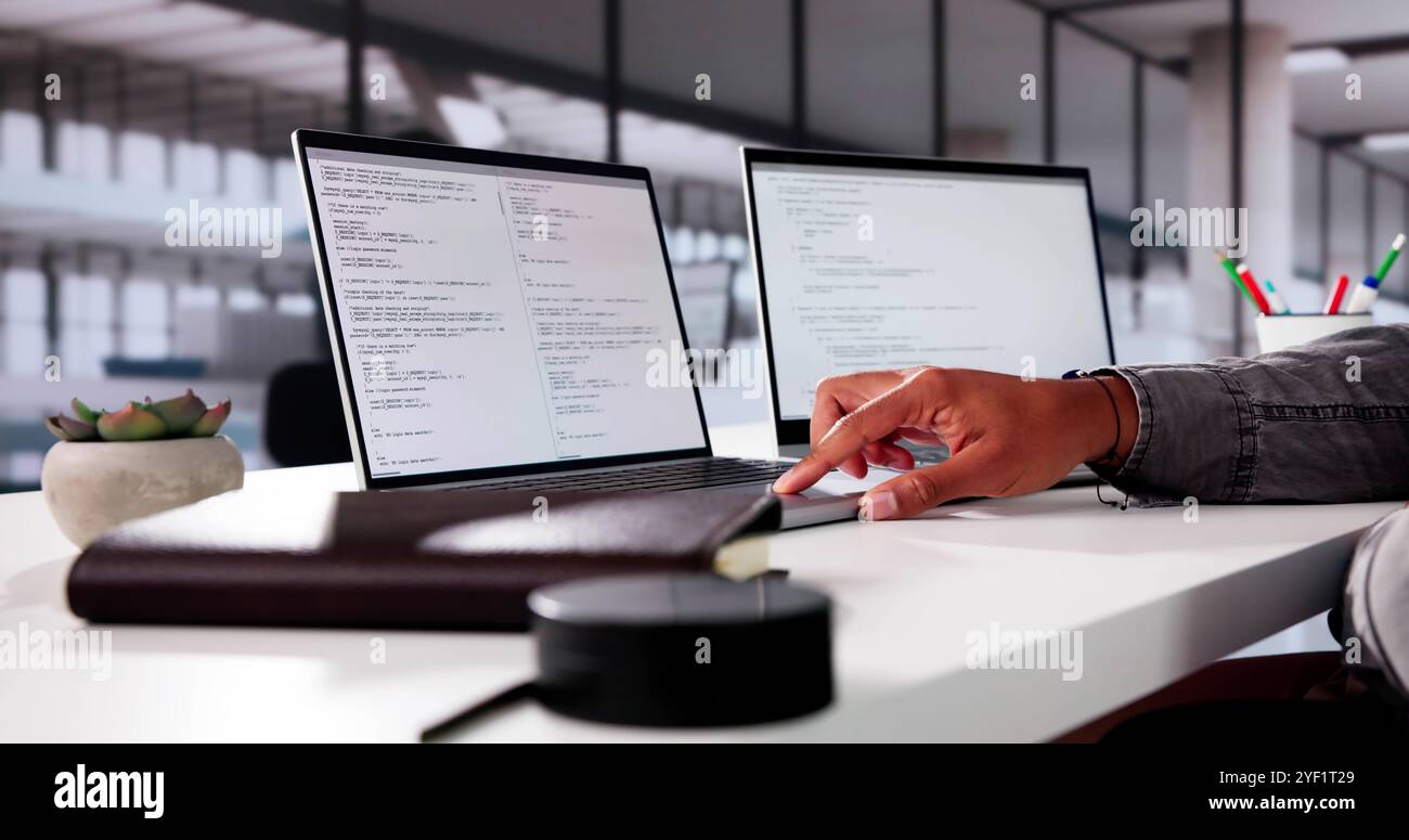Web Developer Programming In Office. Agile Code On Laptop Stock Photo