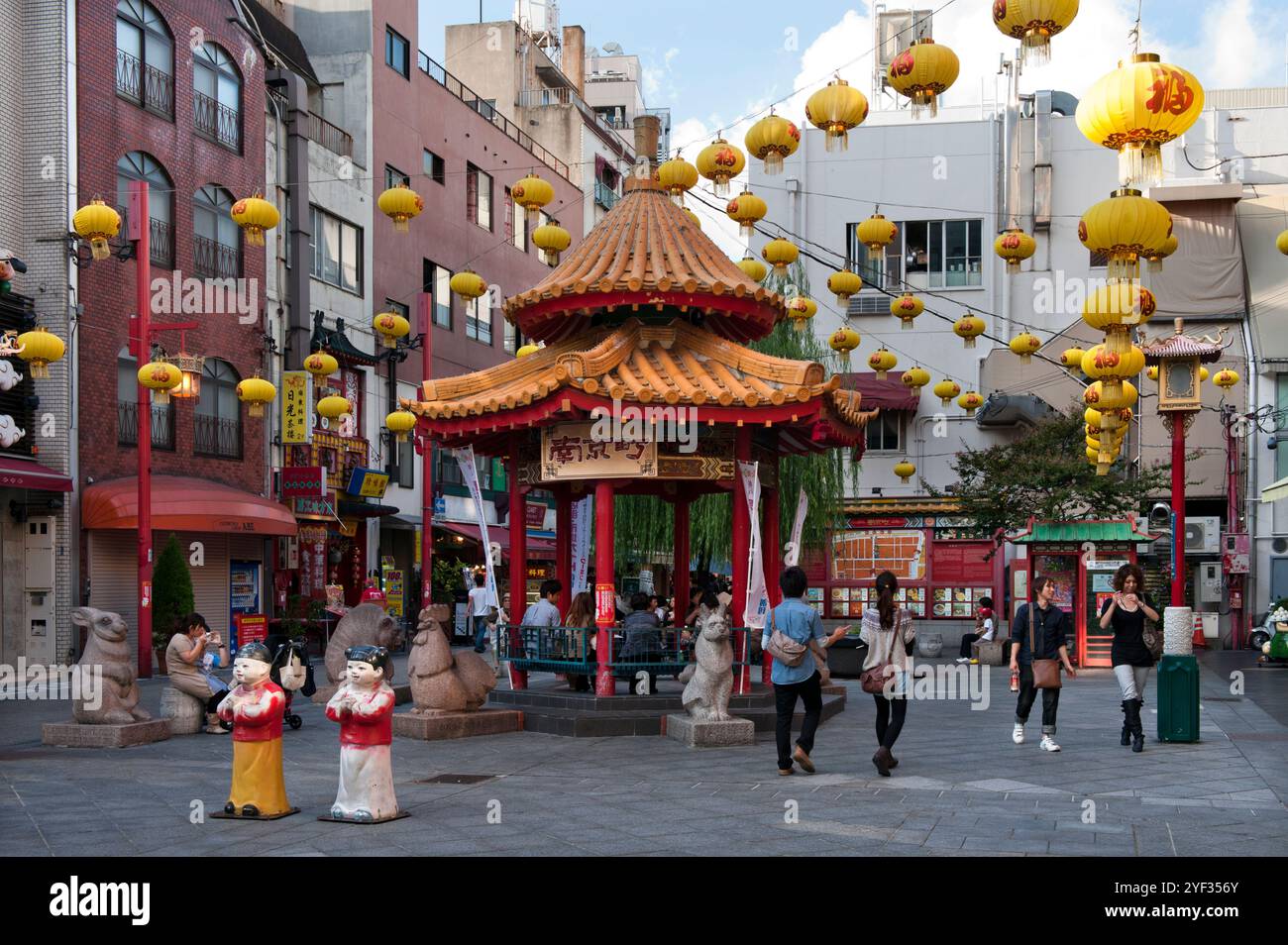 Azumaya Pavilion with yellow lanterns in the center of Nankin-machi Square in Kobe's Chinatown district, Kobe City, Japan. Stock Photo