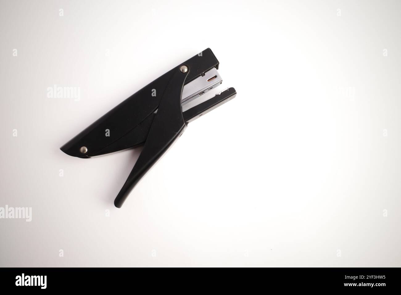 Isolated Black Handheld Stapler on White Background Stock Photo