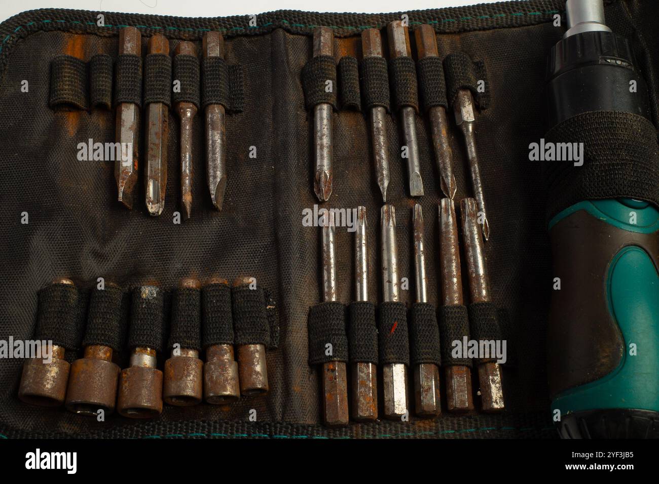Tool set with multiple screwdrivers and bits in a fabric pouch Stock Photo