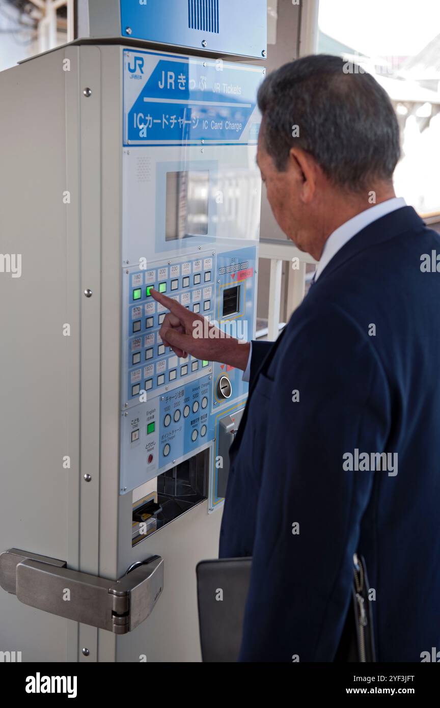 Japan vending machine suit hi-res stock photography and images - Alamy