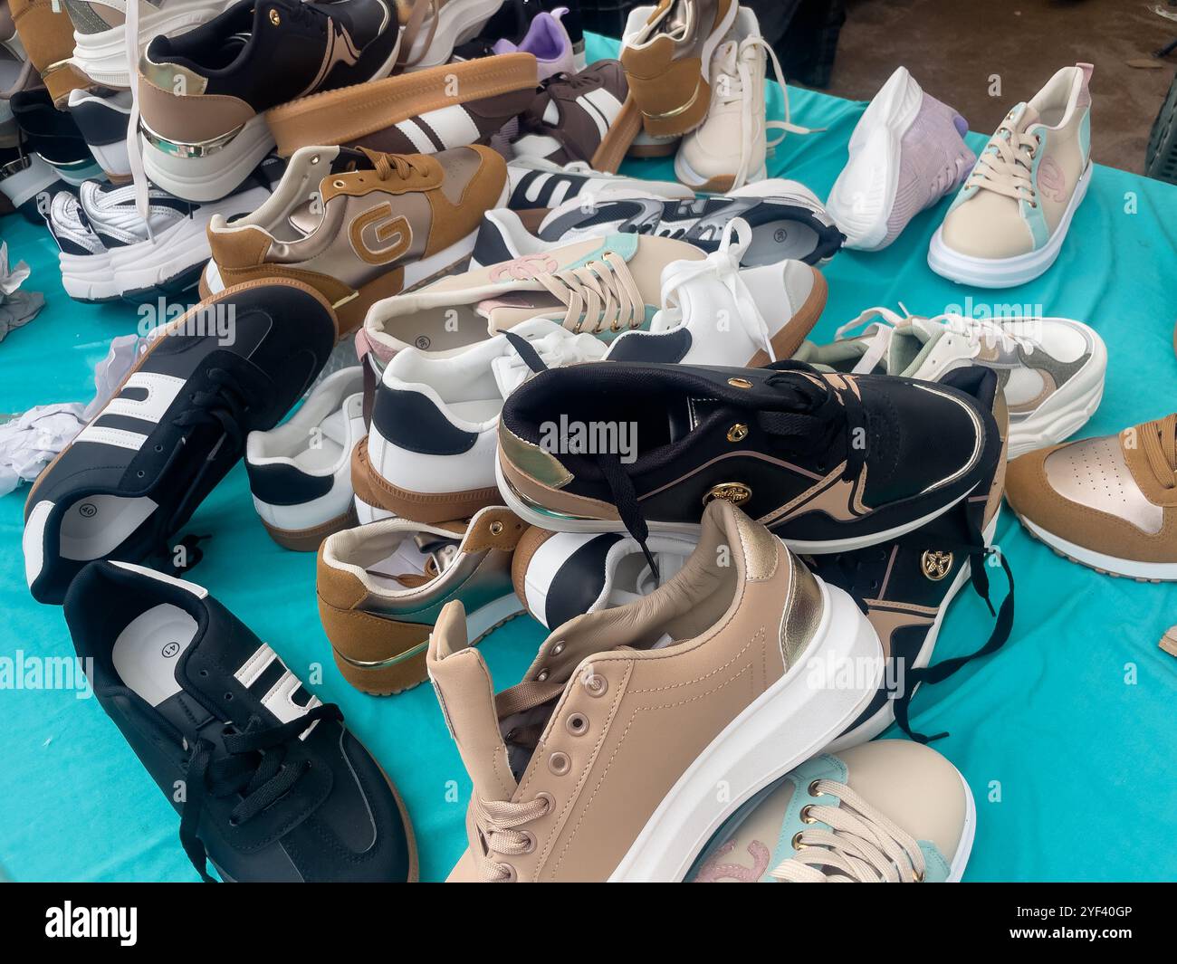 load of shoes on a street market stall, Vic, Catalonia, Spain - Smartphone Captured Stock Image