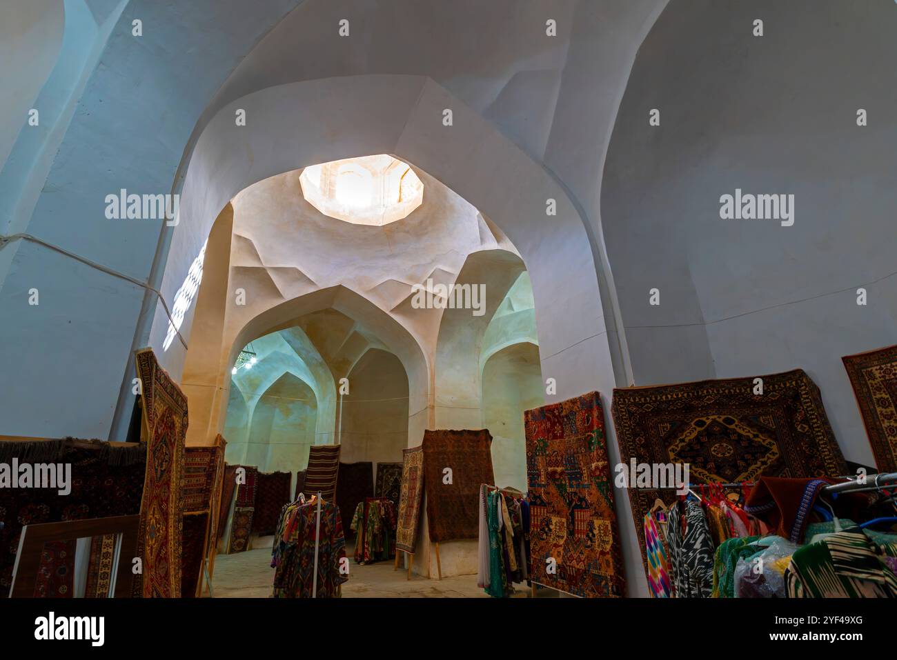 Shops inside passage in Toki Zargaron bazaar in Bukhara old town, Uzbekistan. Stock Photo