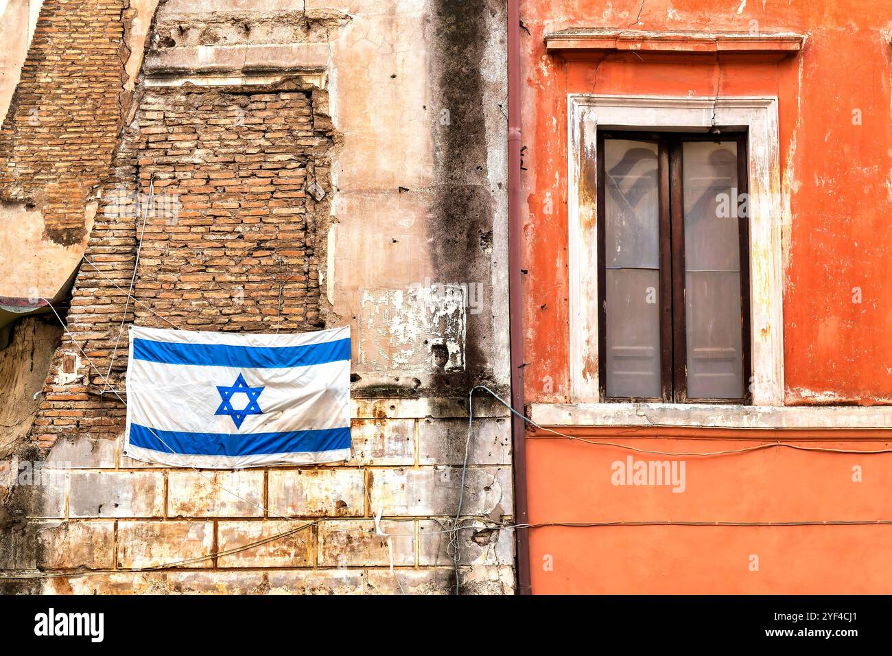 An Israeli flag displayed on one of the old buildings in the Jewish Ghetto of Rome, Italy. Stock Photo