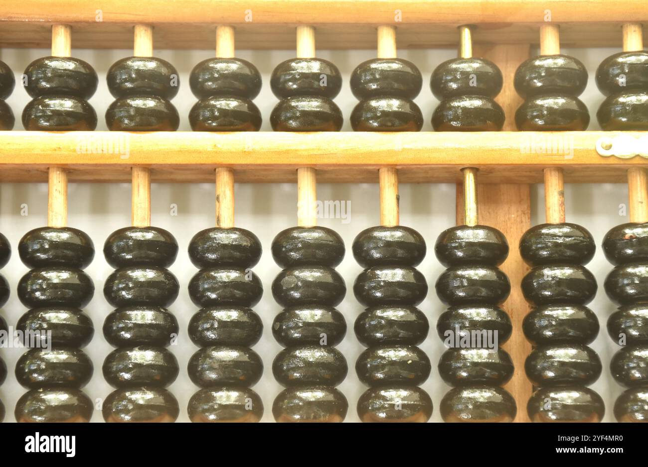 wooden abacus old Chinese tool for calcuated arraning on white background Stock Photo
