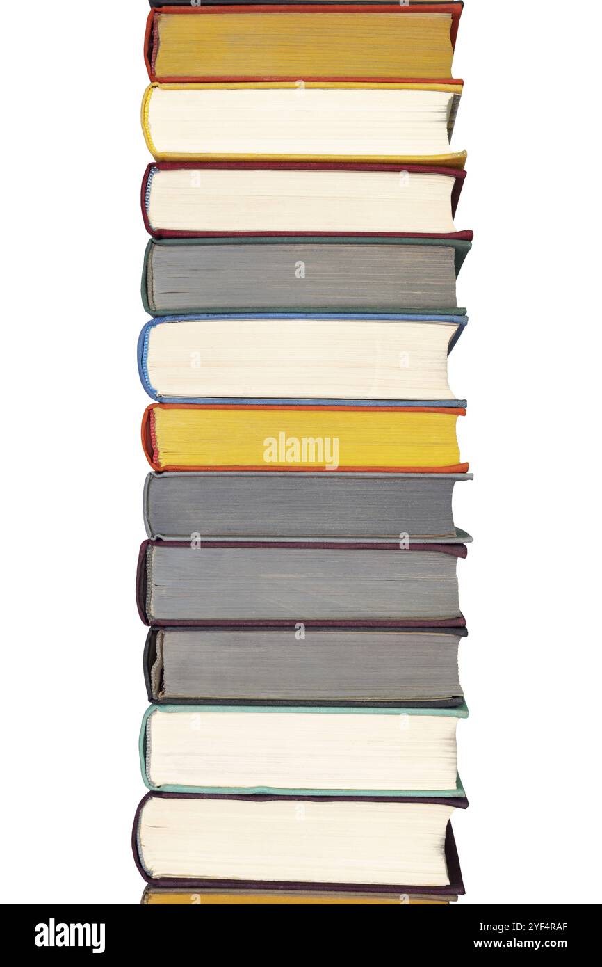 Stack of hardcover books on bookshelf. Close up view of multi colored vintage hardback books isolated on white background Stock Photo