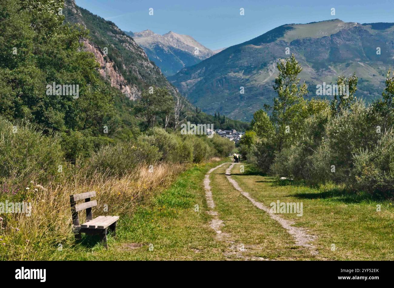 Scenic Mountain Path with Bench Stock Photo - Alamy