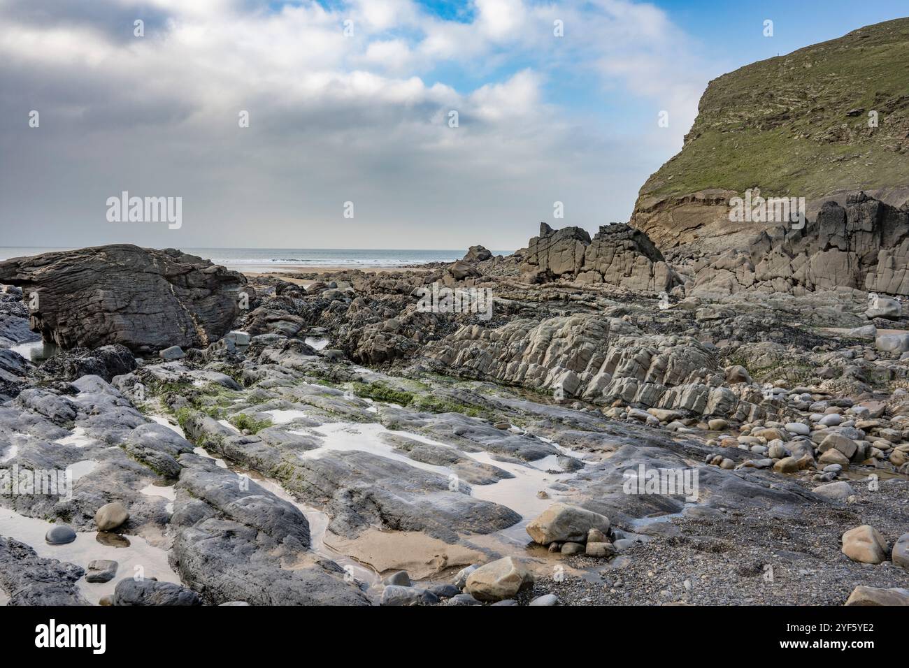 Rain clouds disperse over Duckpool in Cornwall Stock Photo