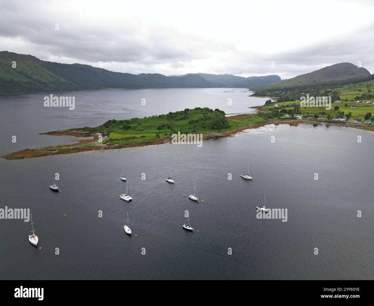 Aerial drone view of the Scottish Highland village of Lochcarron, alongside the loch, Wester Ross, Scotland, June 2024 Stock Photo