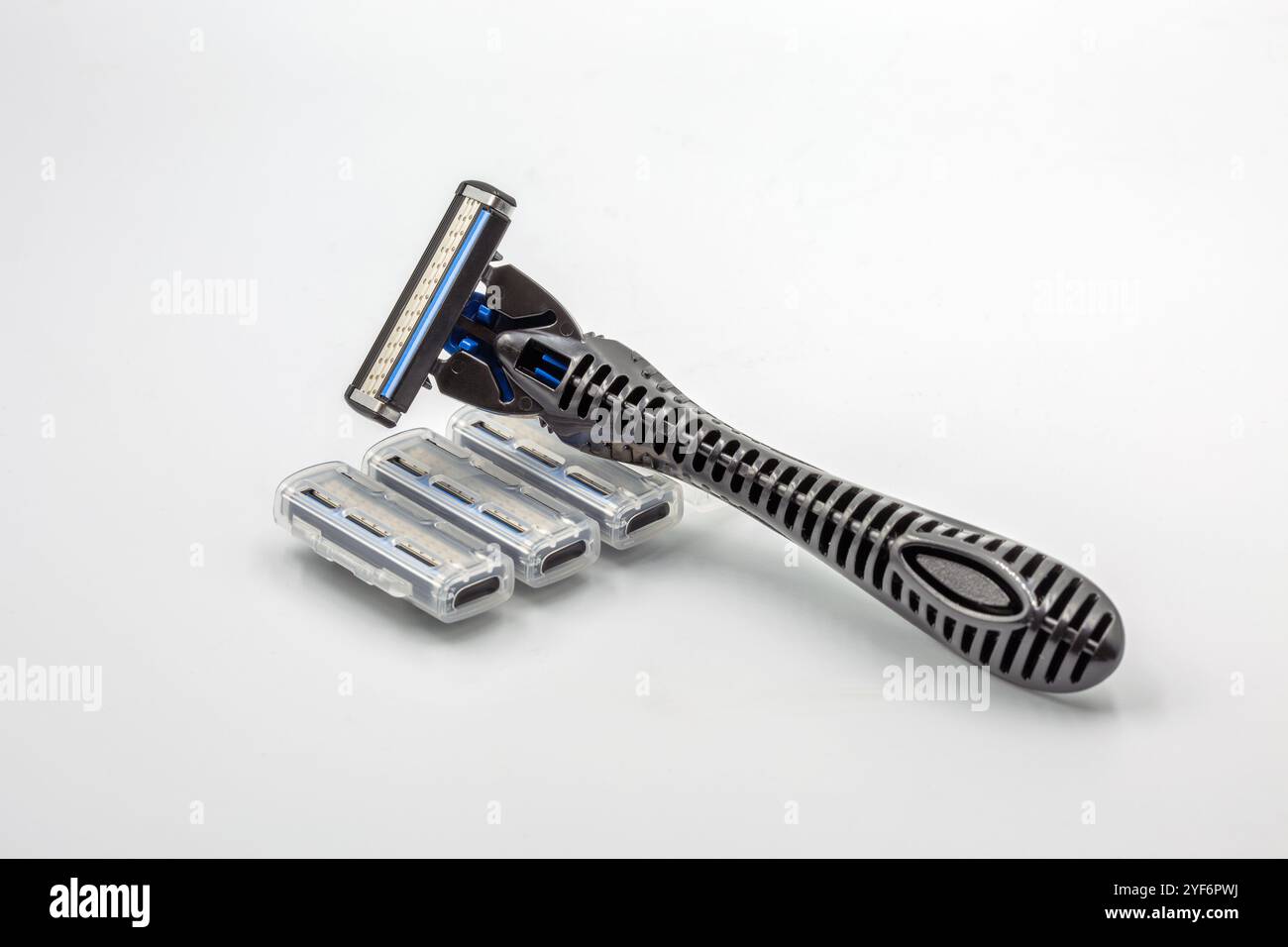 Studio shoot shaving razors machine with replaceable cassette blades closeup on white. Stock Photo