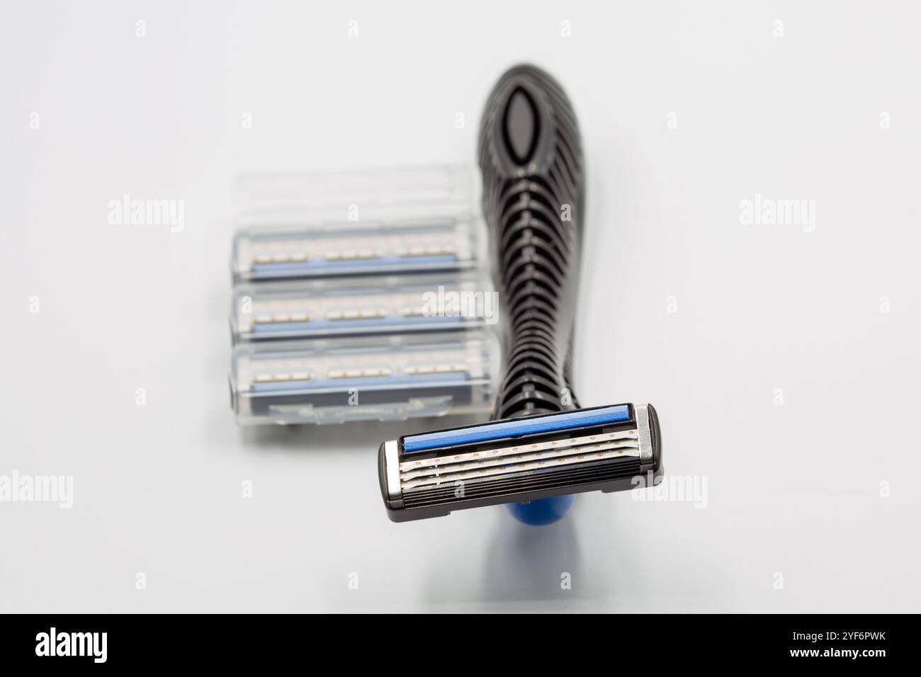 Studio shoot shaving razors machine with replaceable cassette blades closeup on white. Stock Photo