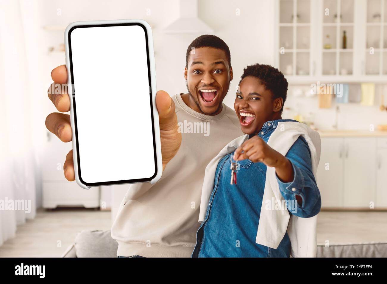 Happy African American couple showing keys of their new apartment Stock ...