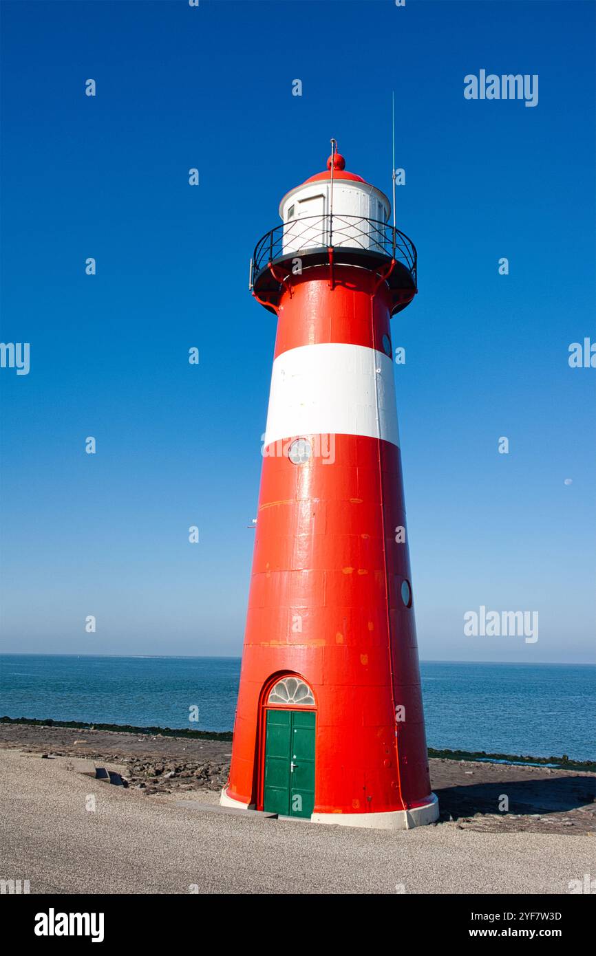 Beautiful lighthouse on the Dutch North Sea coast on a sunny morning ...