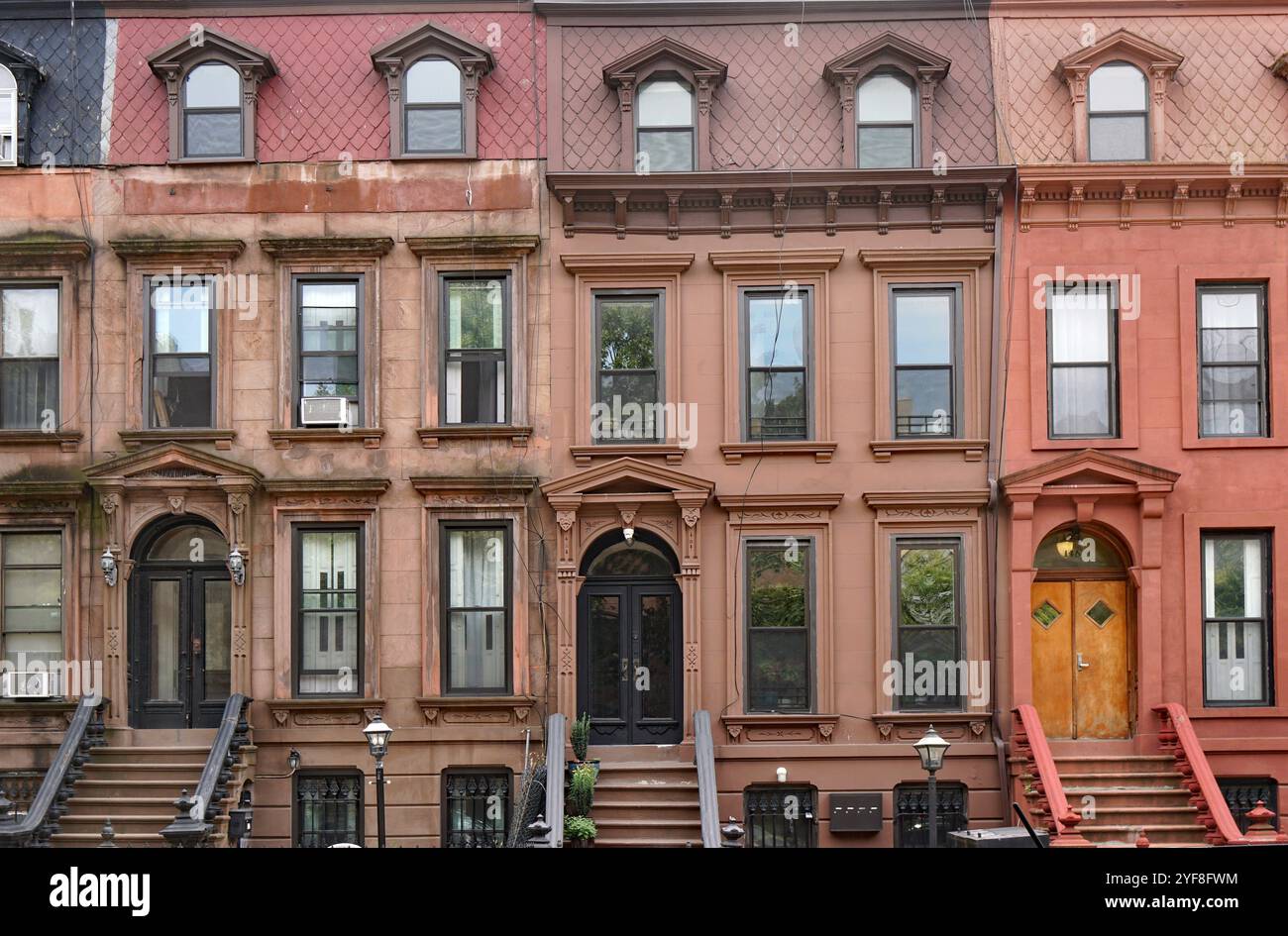 Old brownstone style apartment buildings or townhouses in New York City Stock Photo