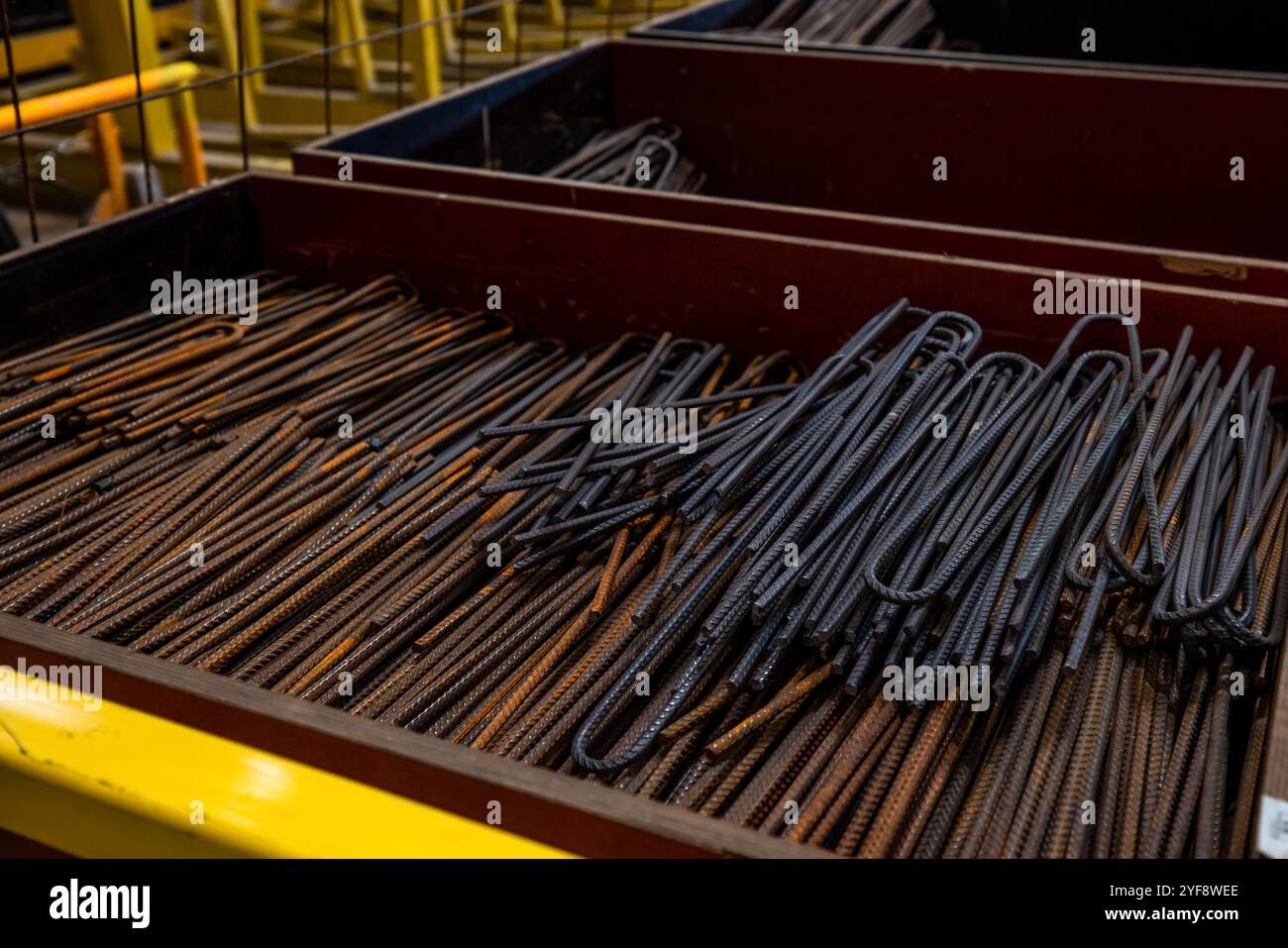 Steel rods or bars used to reinforce concrete, in warehouse at the ...