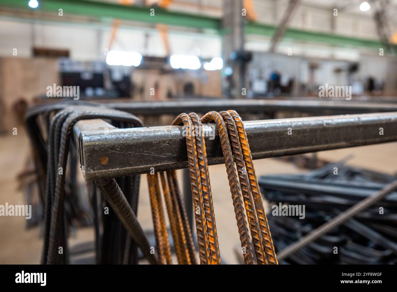 Steel rods or bars used to reinforce concrete, in warehouse at the ...