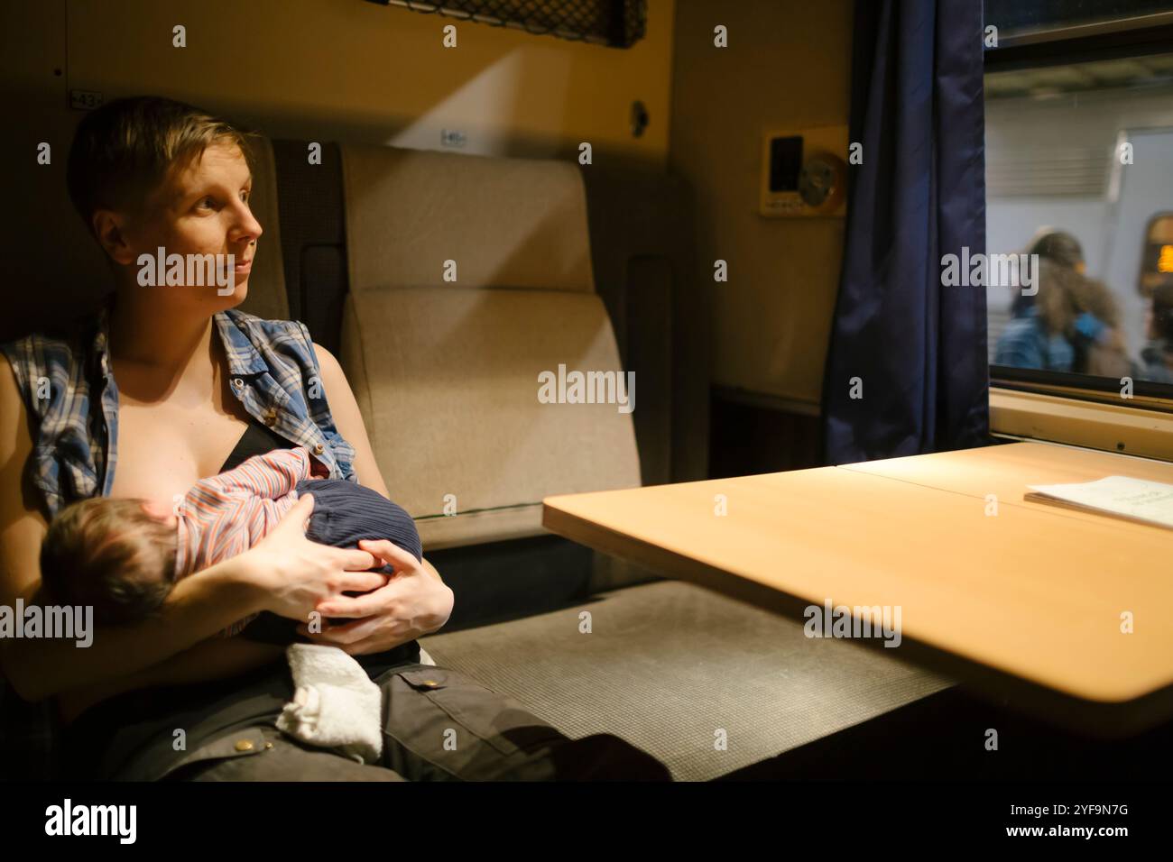 Mother Breastfeeding Son While Sitting On Seat In Train Stock Photo Alamy mother-breastfeeding-son-while-sitting-on-seat-in-train-stock-photo-alamy