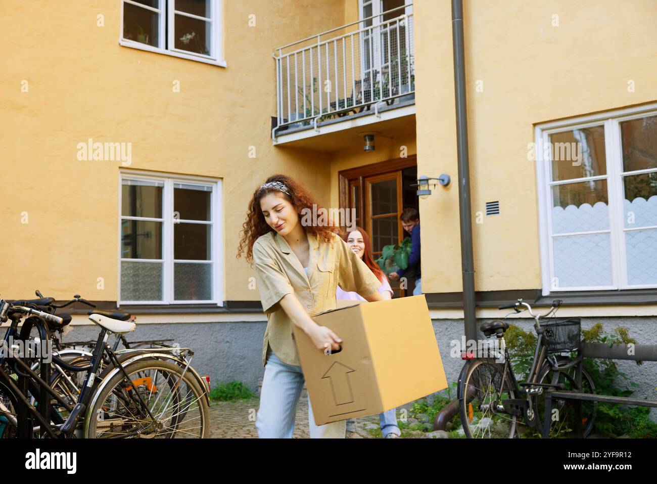 Mature woman carrying cardboard hi-res stock photography and images - Alamy