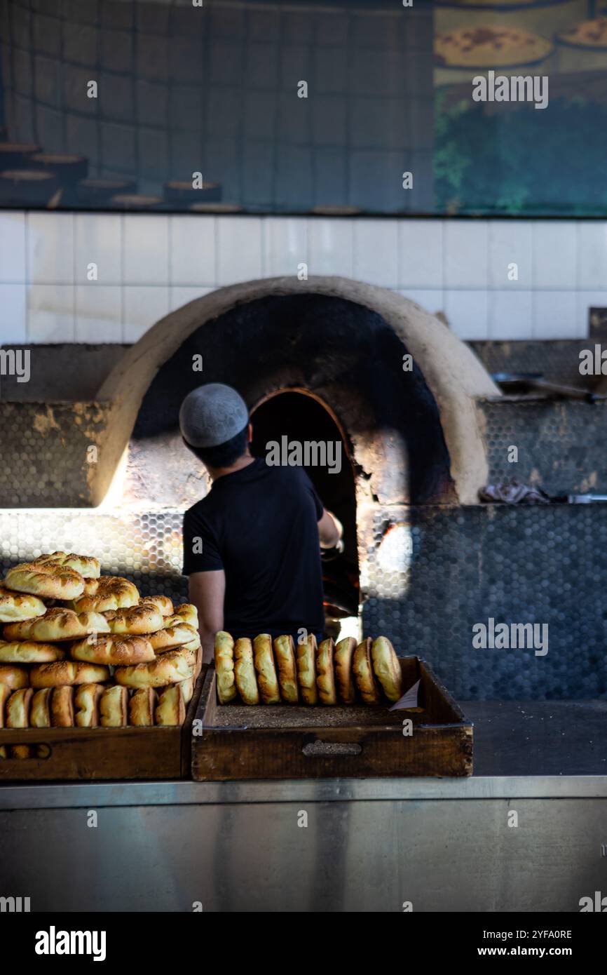 a process of cooking the uzbek bread in Central Asian Pilaf Center, Tashkent Uzbekistan Stock Photo