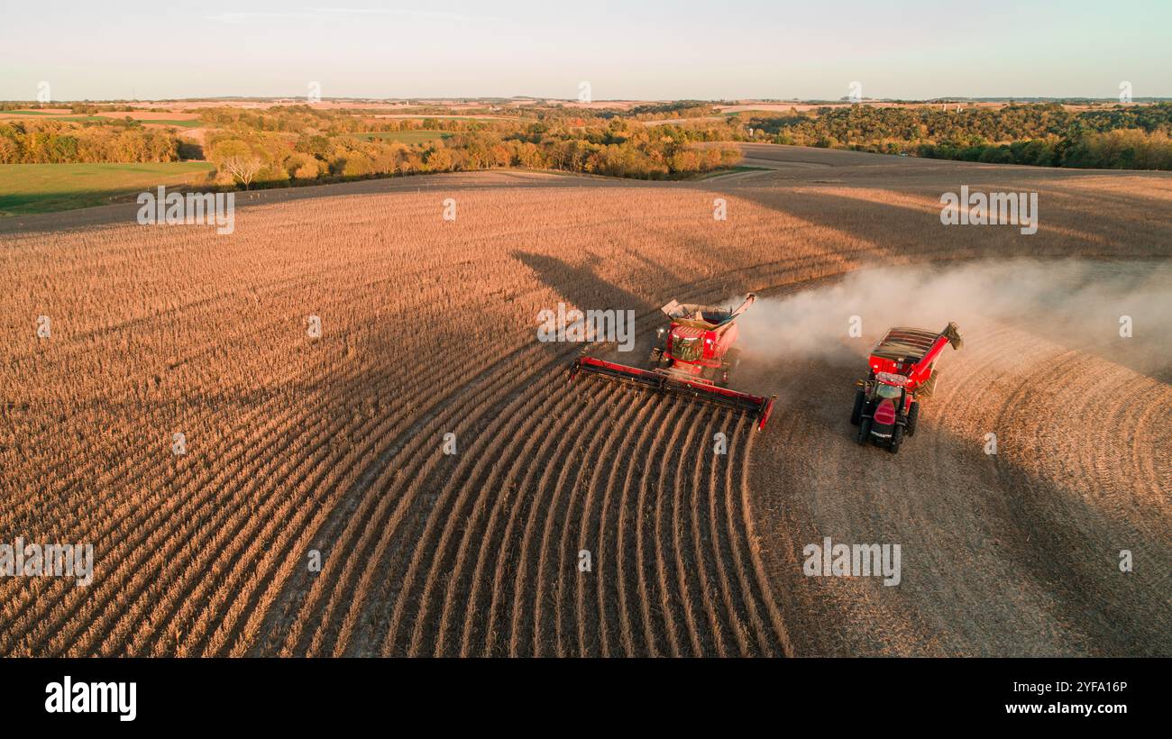 A Combine Harvester Cutting Through Golden Crops During Harvest Stock Photo Inspiration