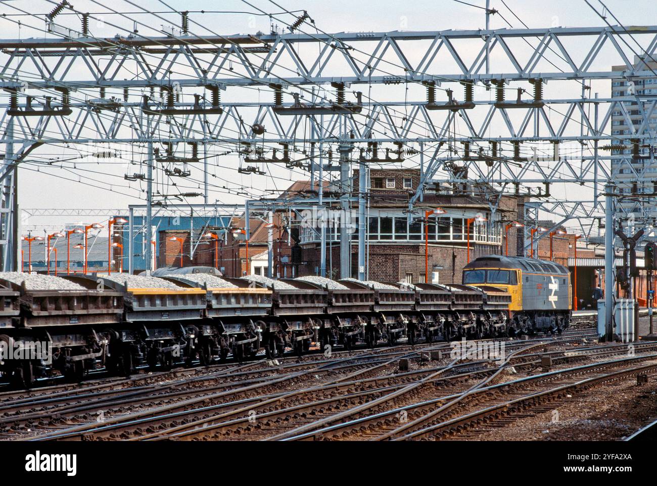 A Class 47 diesel locomotive number 47337 with along rake of loaded ZJV ...