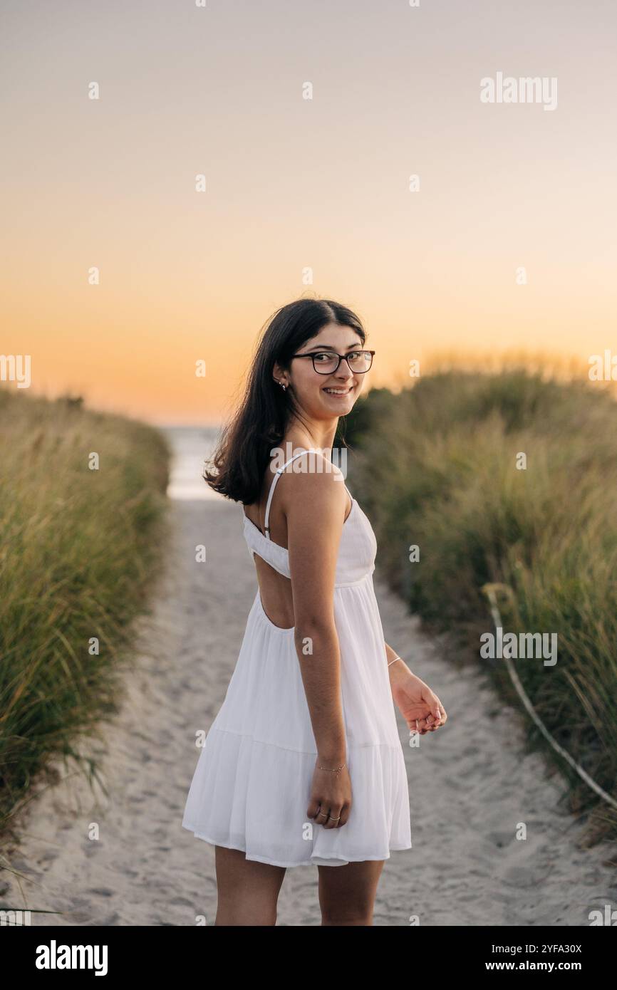 Woman in white dress walking hi-res stock photography and images - Alamy