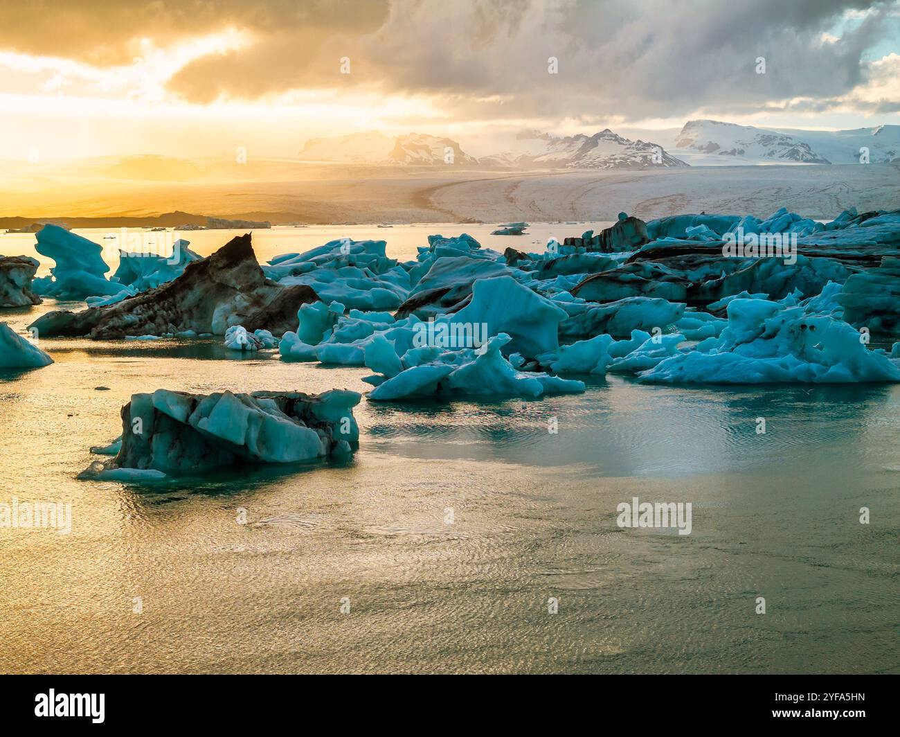 Aerial view of Jokulsarlon Glacier Lagoon at sunset, featuring stunning ...