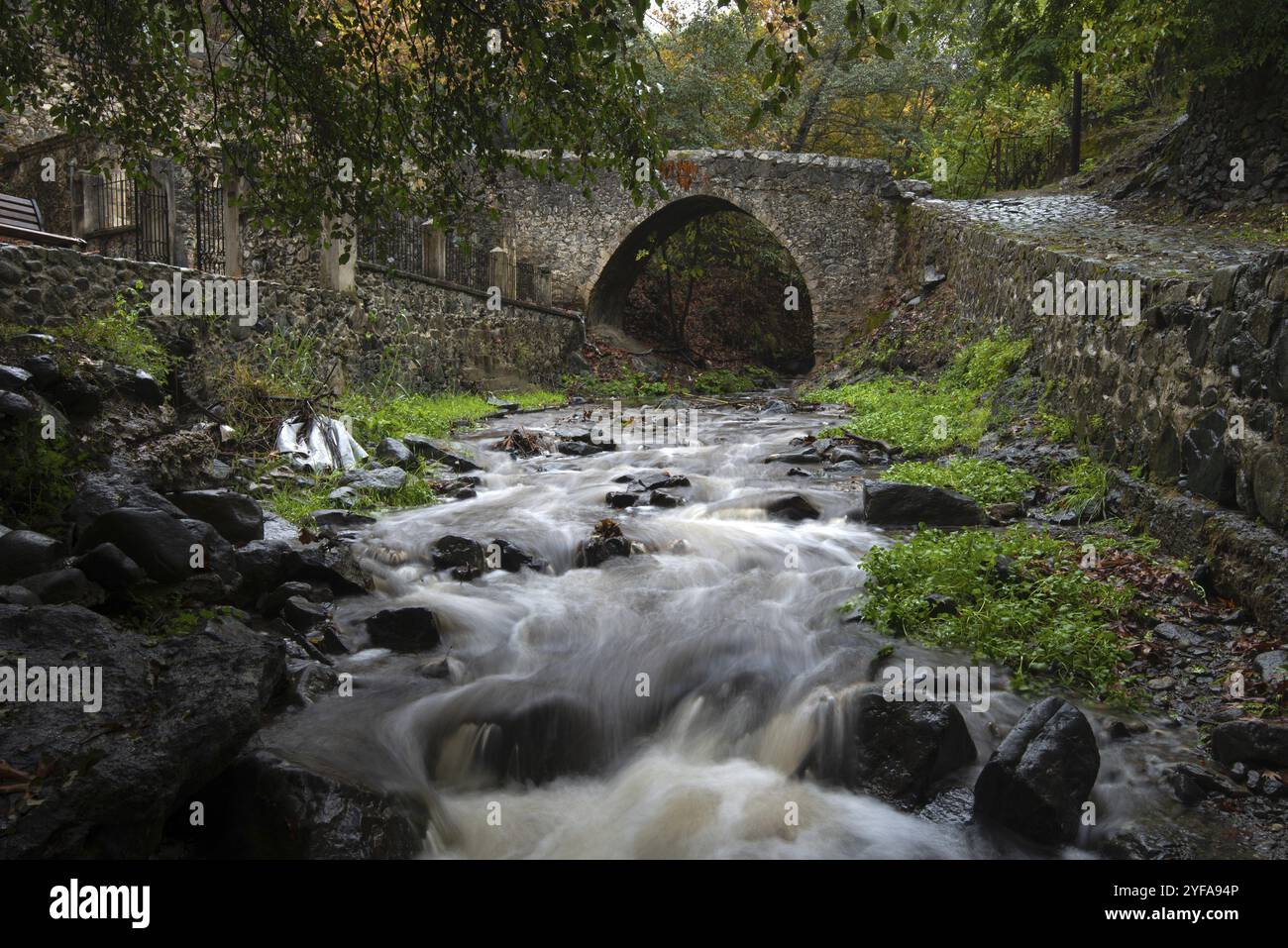 Medieval stoned bridge water flowing in the river. Kalopanayiotis ...