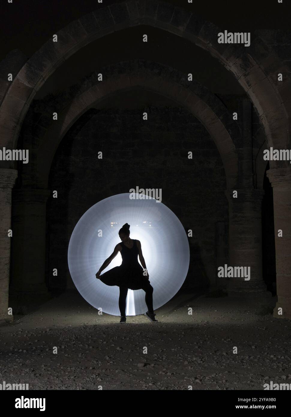 Light From Behind Examples Young woman dancing below an old stoned column with circle of painting ...