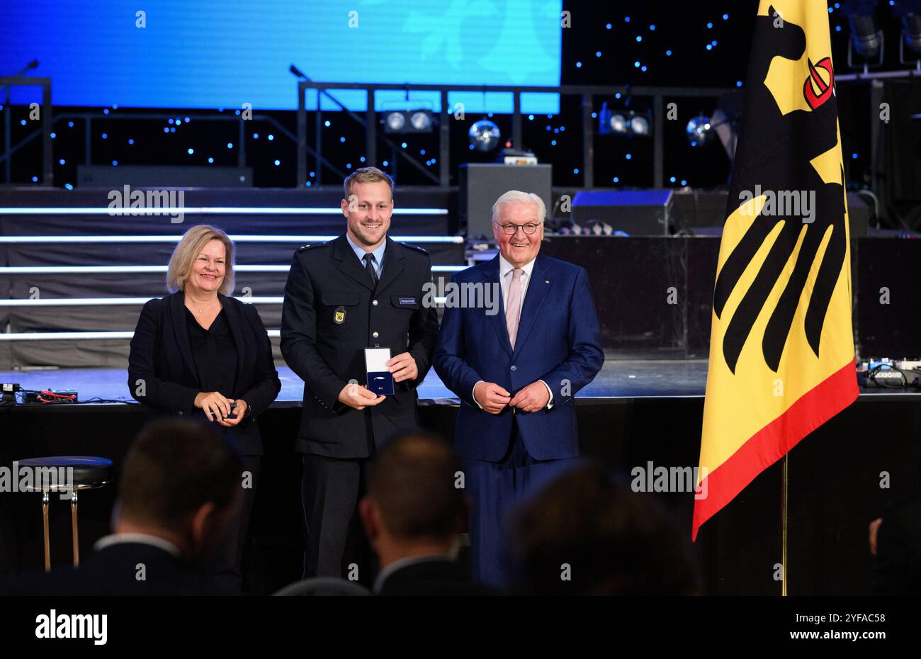04 November 2024, Berlin: Max Rendschmidt (canoe) is presented with the ...