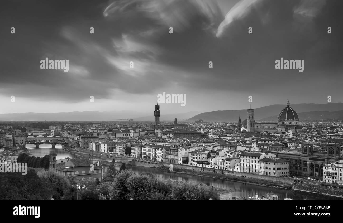 Panoramic Skyline of the historical city of Florence in Italy from Michelangelo piazza just before the sunset. Black and white photo Stock Photo