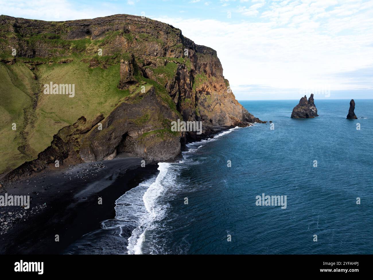 Aerial view of the cliffs and sea stacks at Reynisfjara black sand ...