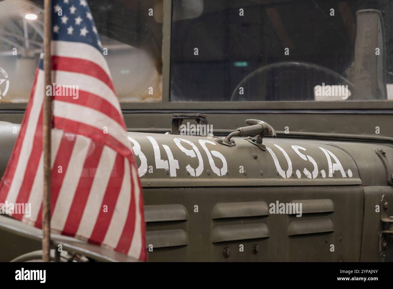 Vintage army jeep with the american flag, symbolizing courage and sacrifice during war, a powerful representation of America's military heritage Stock Photo