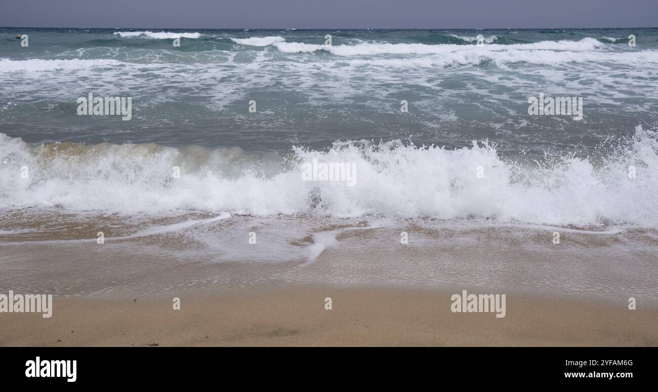 Waves beating shore on beach hi-res stock photography and images - Alamy