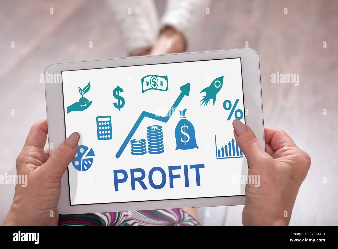 Profit concept shown on a tablet held by a woman Stock Photo