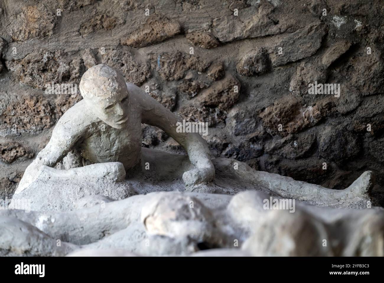 Cast of a victim of the eruption of Mount Vesuvius, Garden of the Fugitives, Archaeological area of Pompeii, Pompei, Campania, Italy Stock Photo