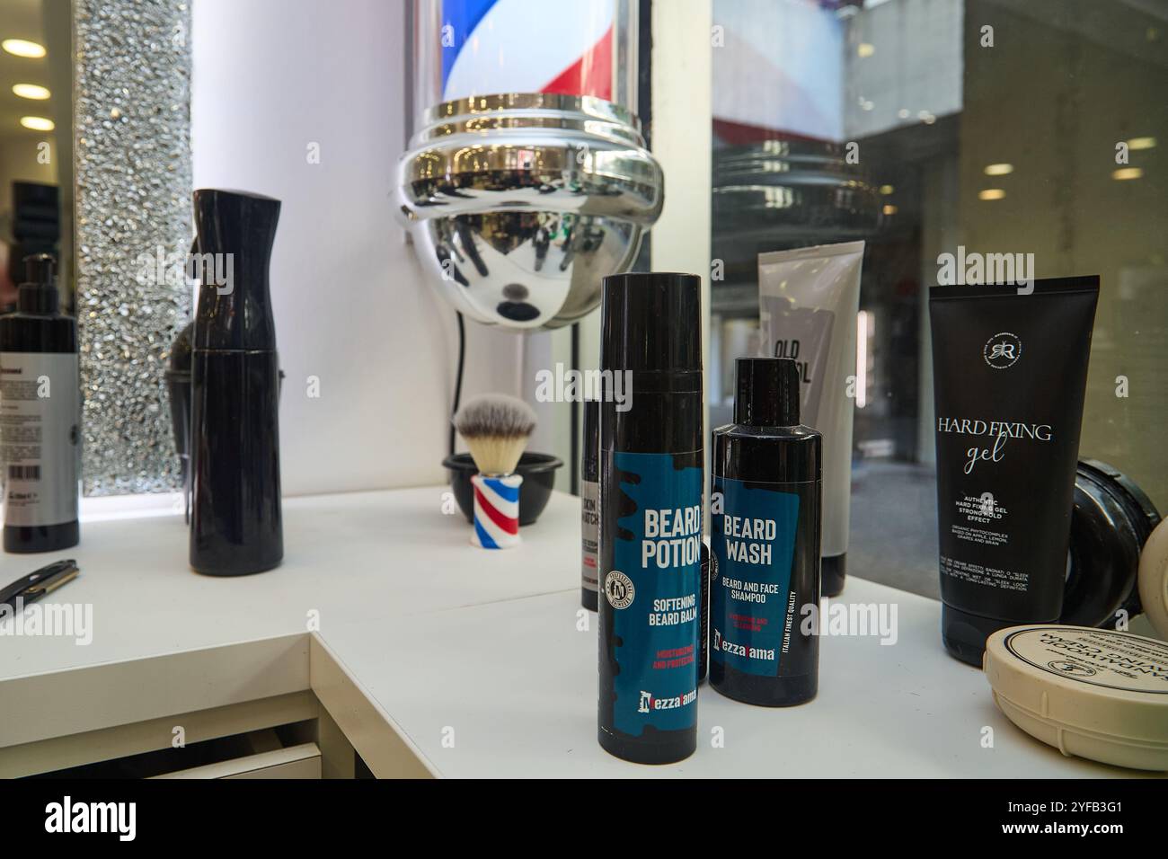 Men's barber's corner in a hair-stylist's shop with men's hair care tools and products Stock Photo