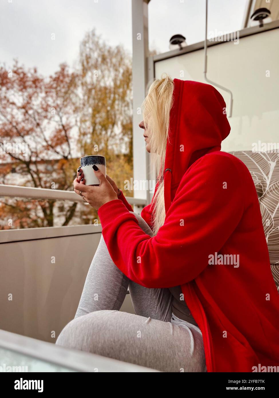 beautiful young woman relaxing over a cup of tea Stock Photo - Alamy