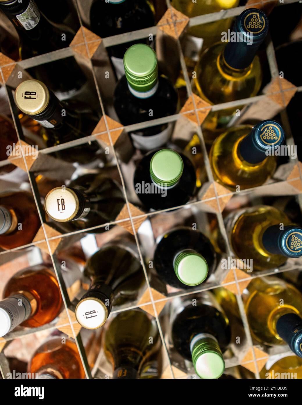 Rows of red and white wine in a modern wooden rack Stock Photo - Alamy