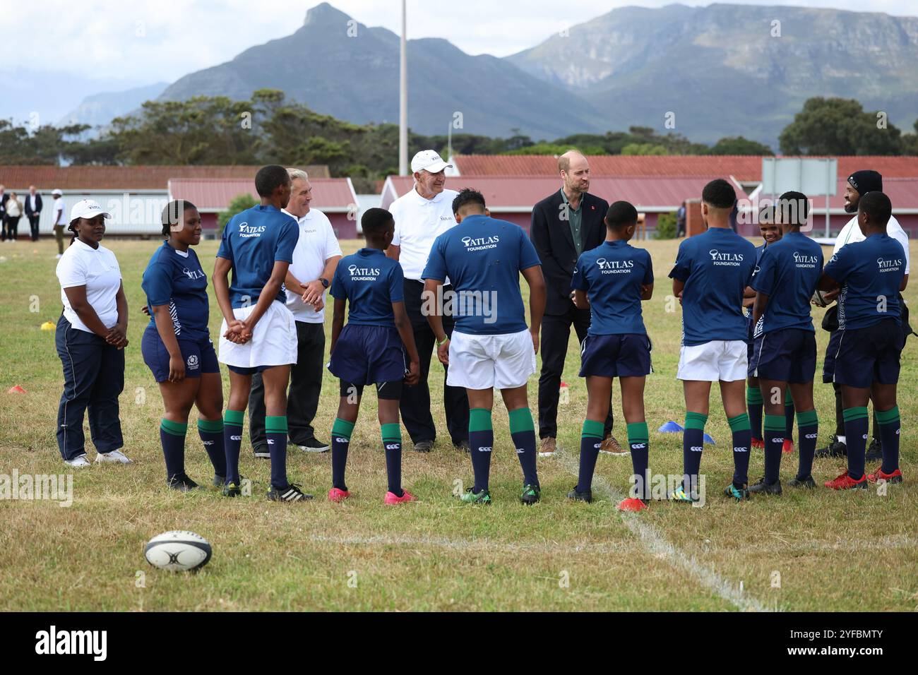 The Prince of Wales takes part in a rugby coaching session, during a visit to Ocean View Secondary School, in Cape Town, to meet young people from Ocean View, Masiphumelele and Langa Townships who regularly participate in the Atlas Foundation's rugby training and digital skills programme, on day one of his visit to South Africa, ahead of the fourth annual Earthshot Prize Awards ceremony on November 6. Picture date: Monday November 4, 2024. Stock Photo